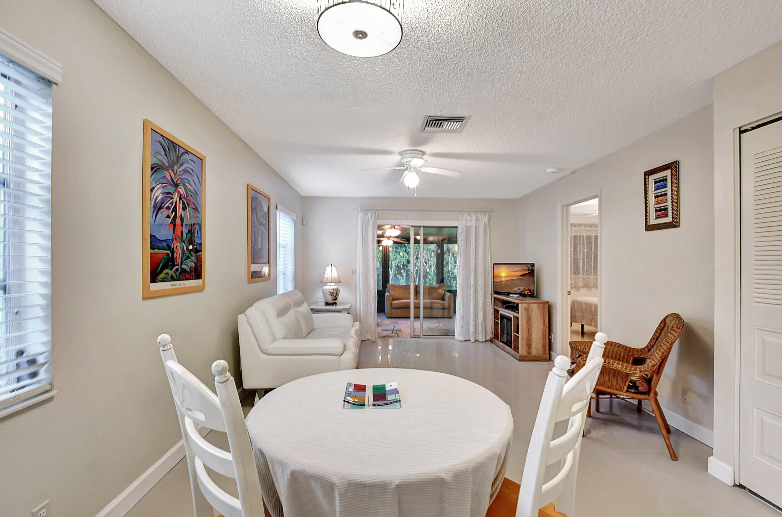 14520 Lucy Drive Delray Beach, FL 33484 - Photo 6 of 63 a dining room with furniture and window