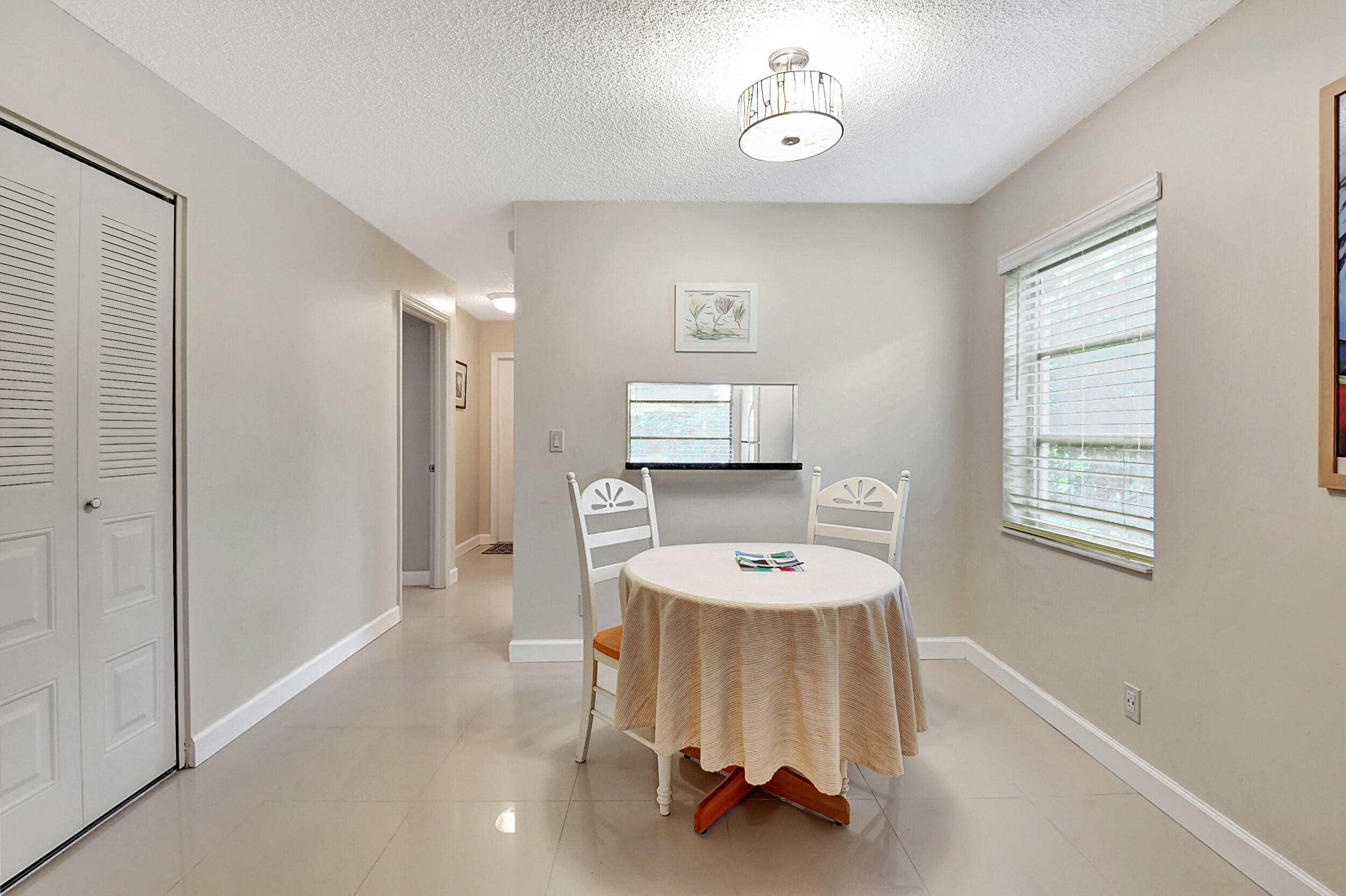 14520 Lucy Drive Delray Beach, FL 33484 - Photo 7 of 63 a room with a table and chairs
