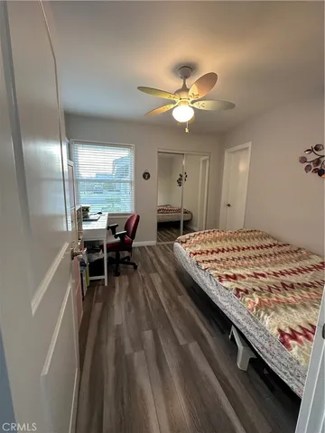 a living room with a bed and furniture