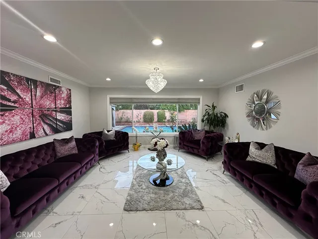 a living room with furniture and a rug