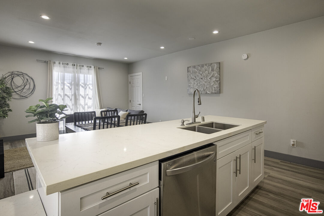 1559 1/2 South Harvard Boulevard Los Angeles, CA 90006 - Photo 3 of 16 a kitchen with a sink and cabinets