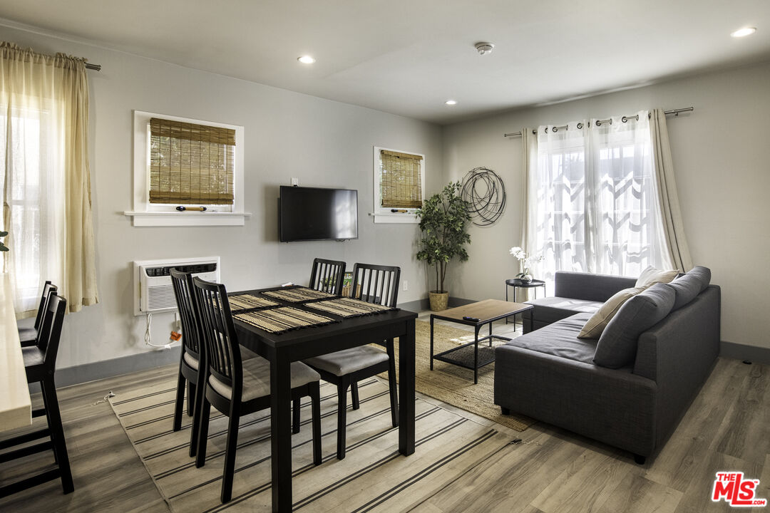 1559 1/2 South Harvard Boulevard Los Angeles, CA 90006 - Photo 5 of 16 a living room with furniture and a window