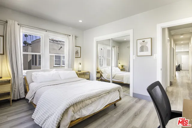 a bathroom with a sink a mirror and a toilet