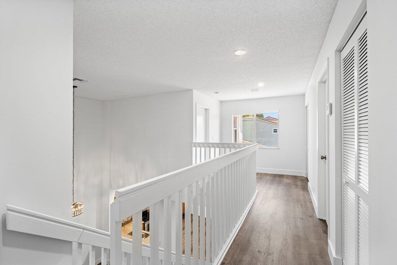 10478 Mateo Court Boca Raton, FL 33498 - Photo 19 of 50 UPSTAIRS HALLWAY