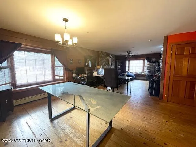 a view of a livingroom with furniture window and wooden floor