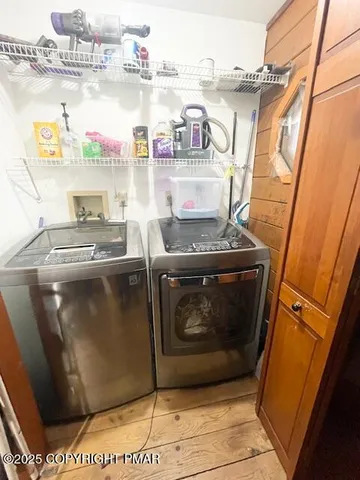 a bedroom with a bed dresser and a ceiling fan