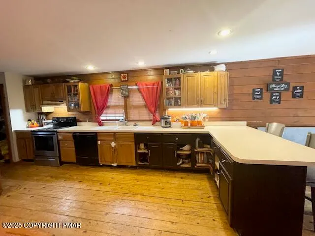 a kitchen with a sink a counter top space and appliances