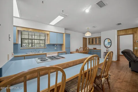 a kitchen with stainless steel appliances granite countertop a sink a stove and a refrigerator