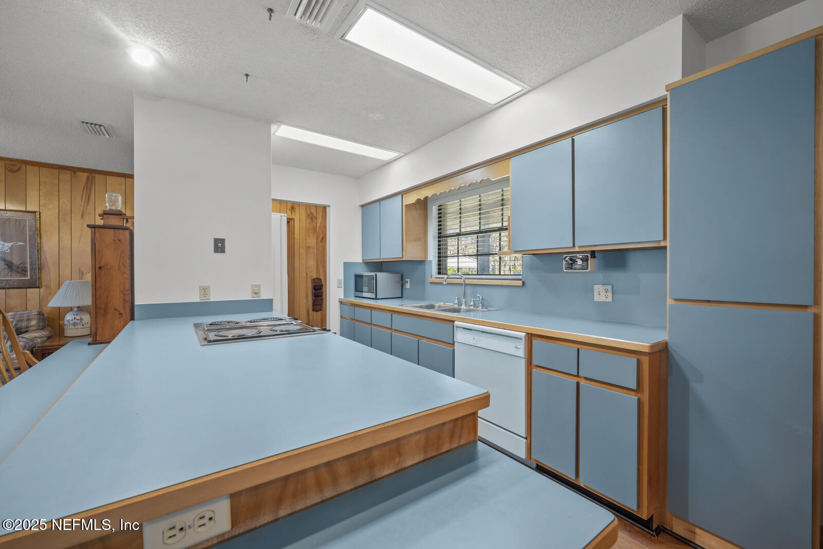 6365 Jack Wright Island Road St. Augustine, FL 32092 - Photo 12 of 53 a kitchen with stainless steel appliances granite countertop a sink a stove and a refrigerator