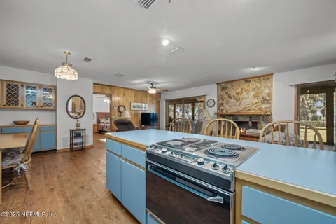 a kitchen with stainless steel appliances granite countertop a stove and a refrigerator