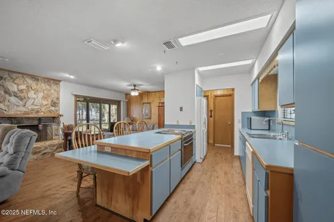 a living room with furniture and a lamp