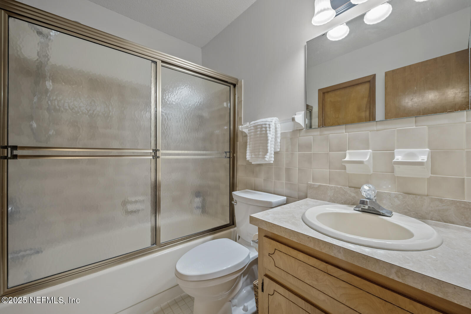 6365 Jack Wright Island Road St. Augustine, FL 32092 - Photo 26 of 53 a bathroom with a sink toilet and shower