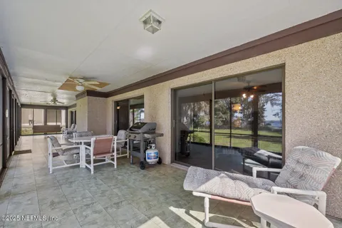 a lobby with furniture and floor to ceiling window