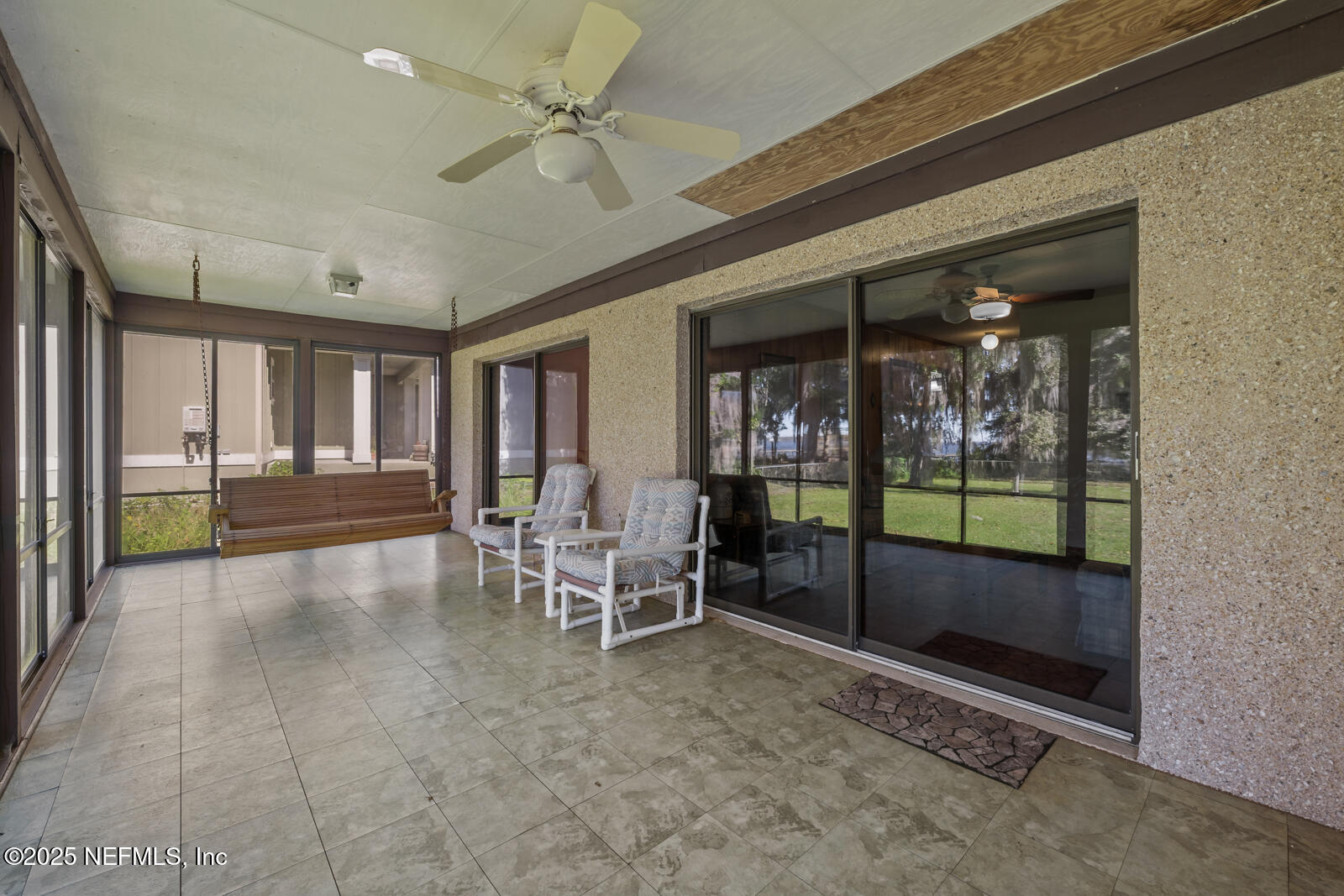 6365 Jack Wright Island Road St. Augustine, FL 32092 - Photo 29 of 53 a lobby with furniture and floor to ceiling window