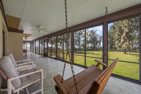 a view of outdoor space with deck area and trees all around