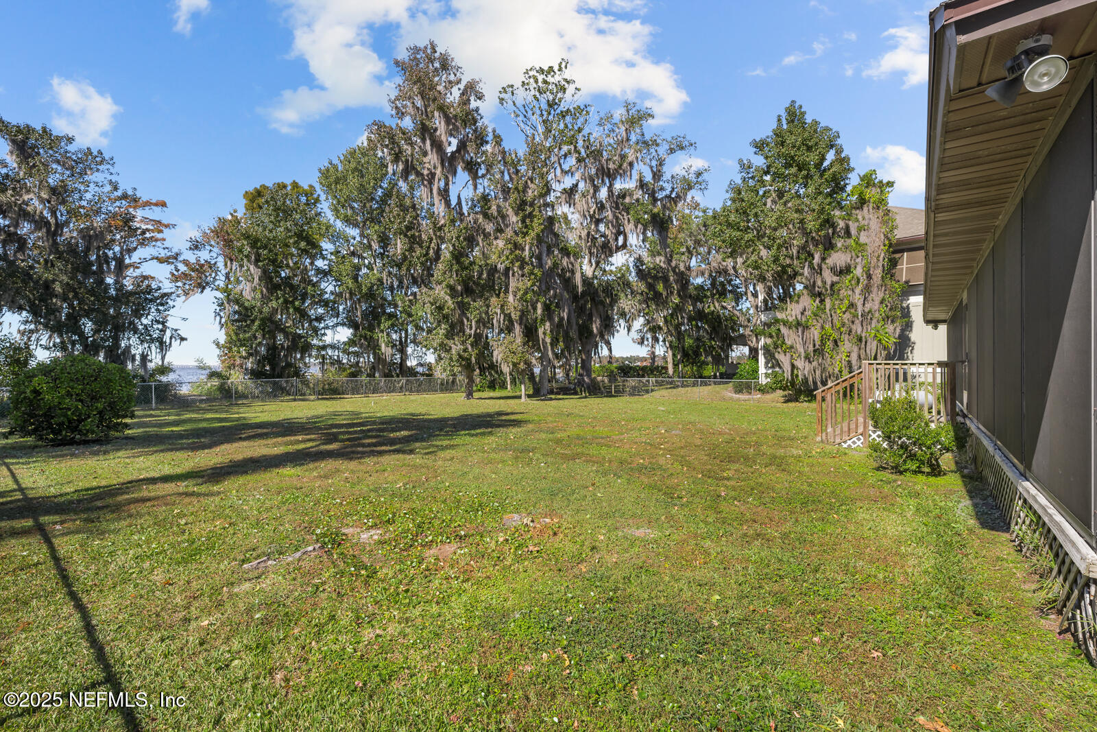 6365 Jack Wright Island Road St. Augustine, FL 32092 - Photo 32 of 53 a view of outdoor space with deck area and trees all around