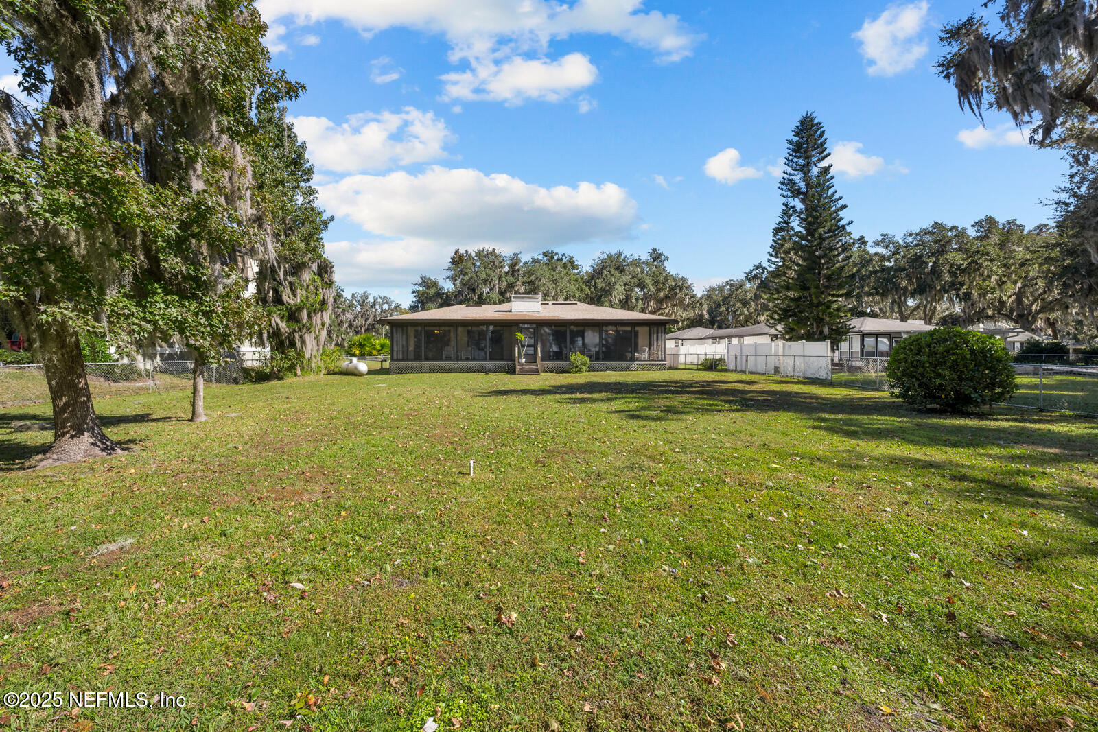 6365 Jack Wright Island Road St. Augustine, FL 32092 - Photo 42 of 53 a view of a house with a yard