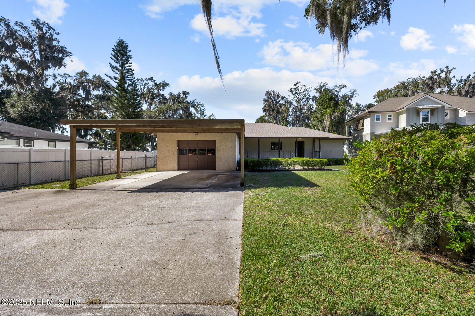 6365 Jack Wright Island Road St. Augustine, FL 32092 - Photo 44 of 53 a view of a house with a backyard