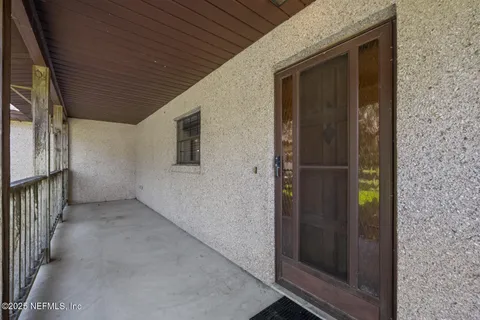 a view of living room with furniture and a window