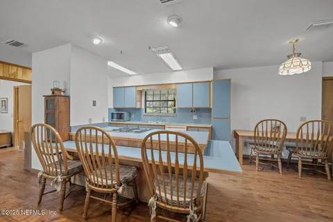 a dining room with furniture and window