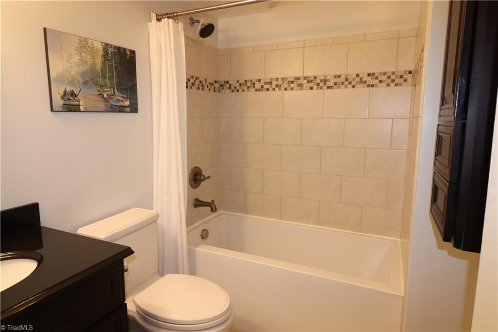5765 Phillips Bridge Road Winston-Salem, NC 27104 - Photo 4 of 29 Beautifully updated bathroom! Has a tile floor that has a heat thermostat so you don't have to step on a cold floor!