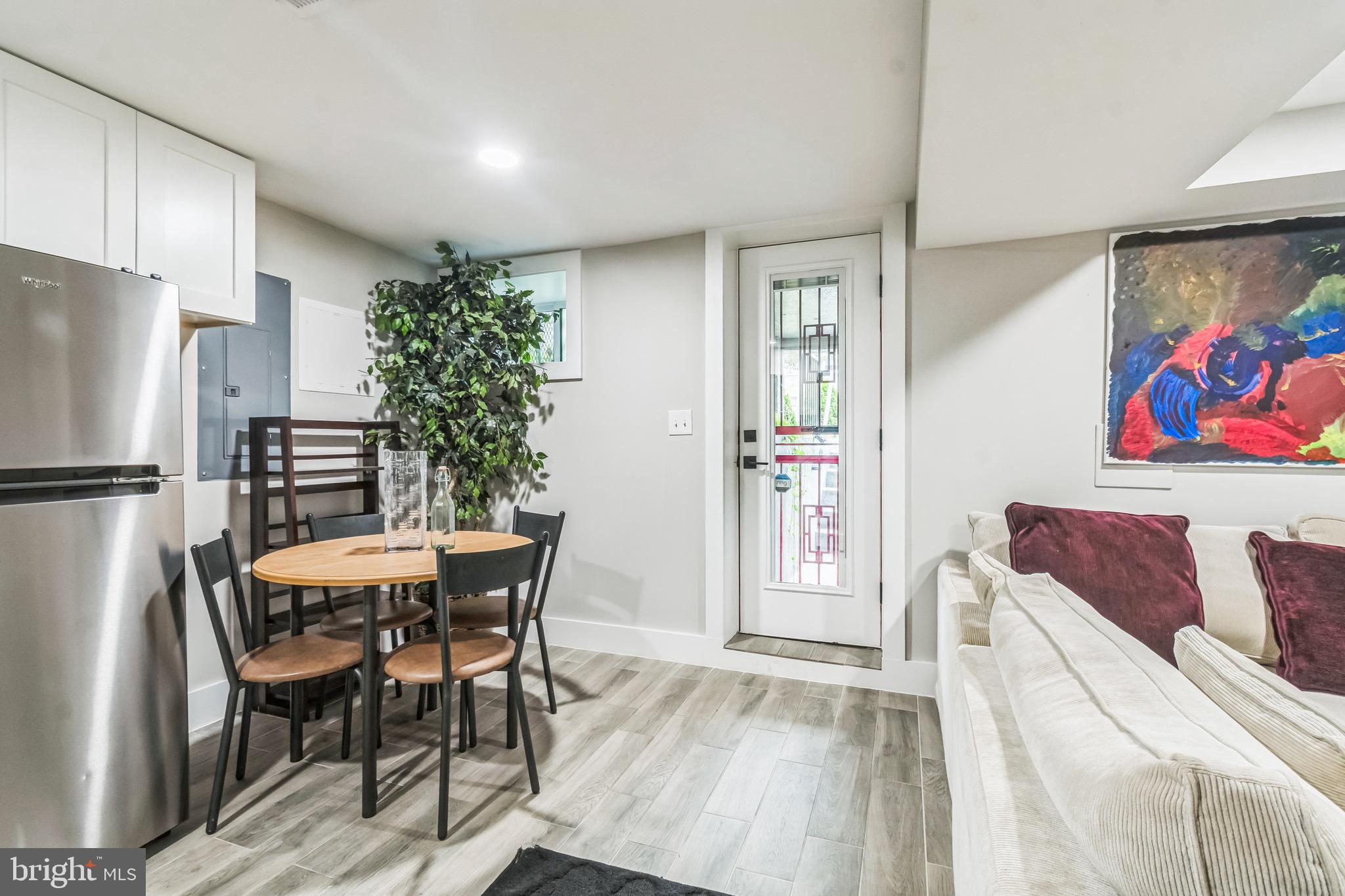 805 B Jefferson Street Northwest Washington, DC 20011 - Photo 11 of 16 a dining room with furniture and a refrigerator