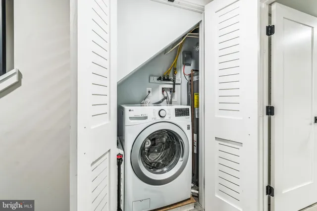 a view of a hallway with washer and dryer
