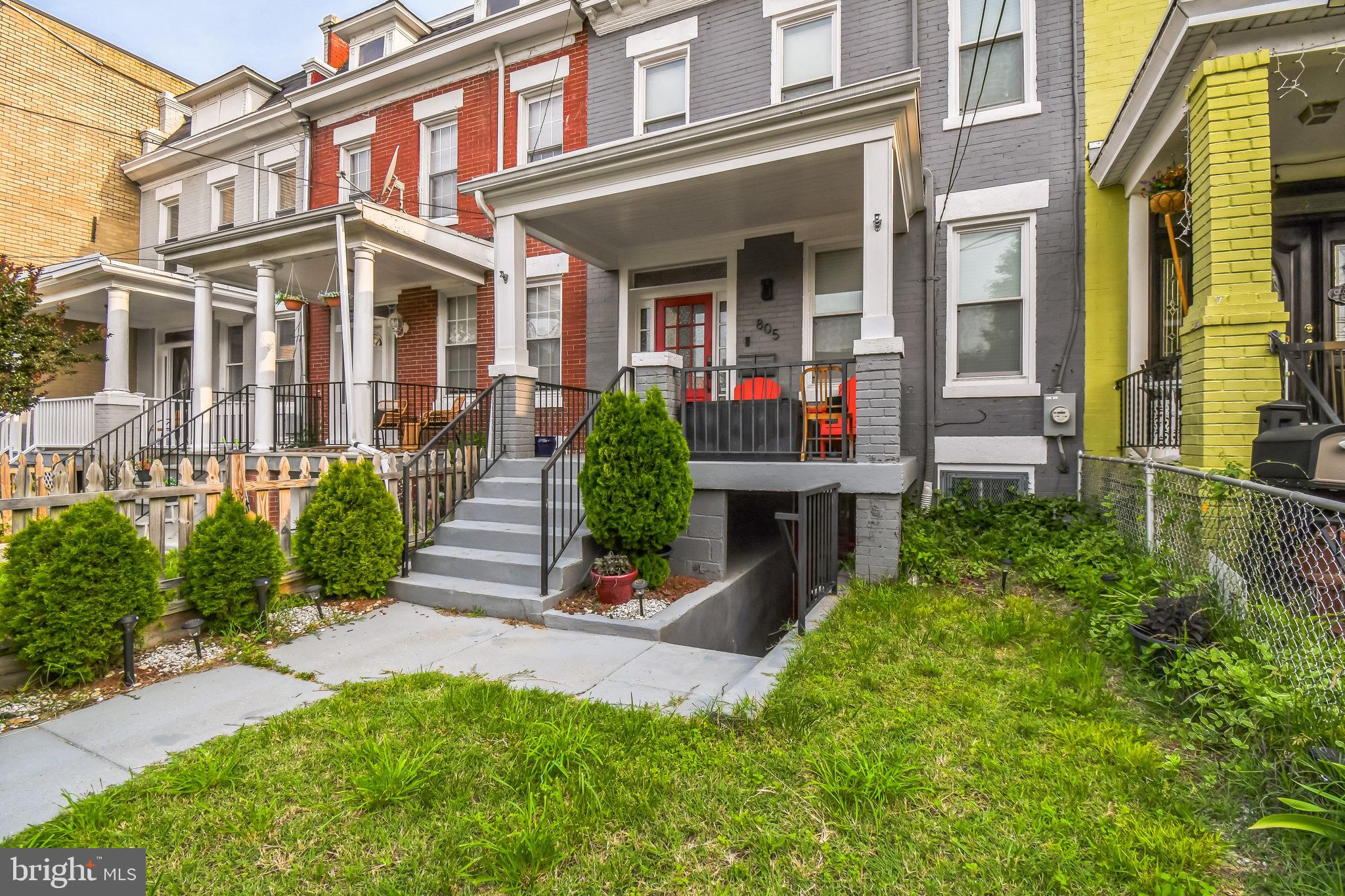 805 B Jefferson Street Northwest Washington, DC 20011 - Photo 14 of 16 front view of a brick house with a yard
