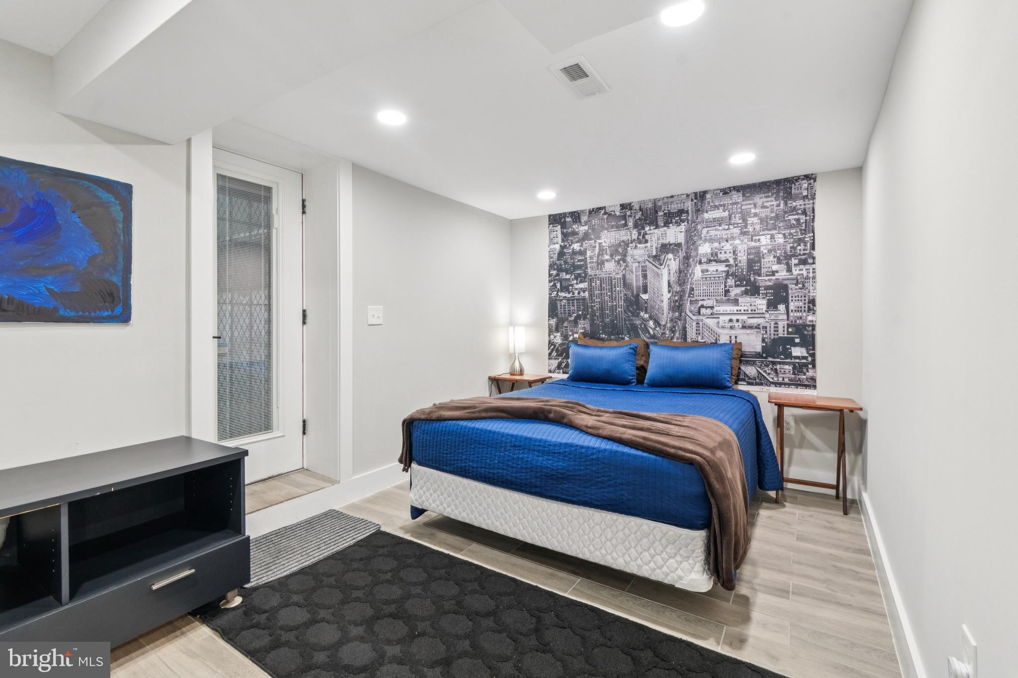 805 B Jefferson Street Northwest Washington, DC 20011 - Photo 8 of 16 a bedroom with a bed and a window
