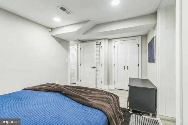a bedroom with a bed and a walk in closet