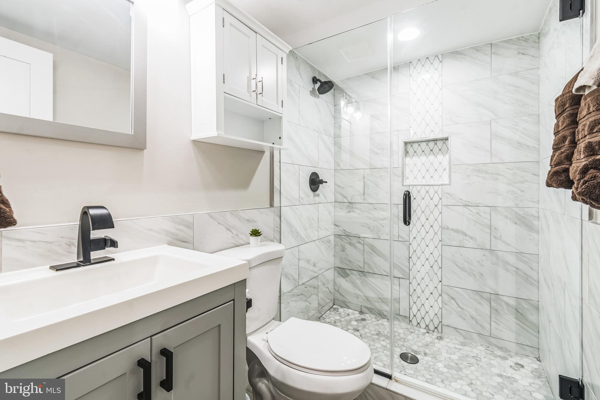 805 B Jefferson Street Northwest Washington, DC 20011 - Photo 10 of 16 a bathroom with a sink a toilet and shower