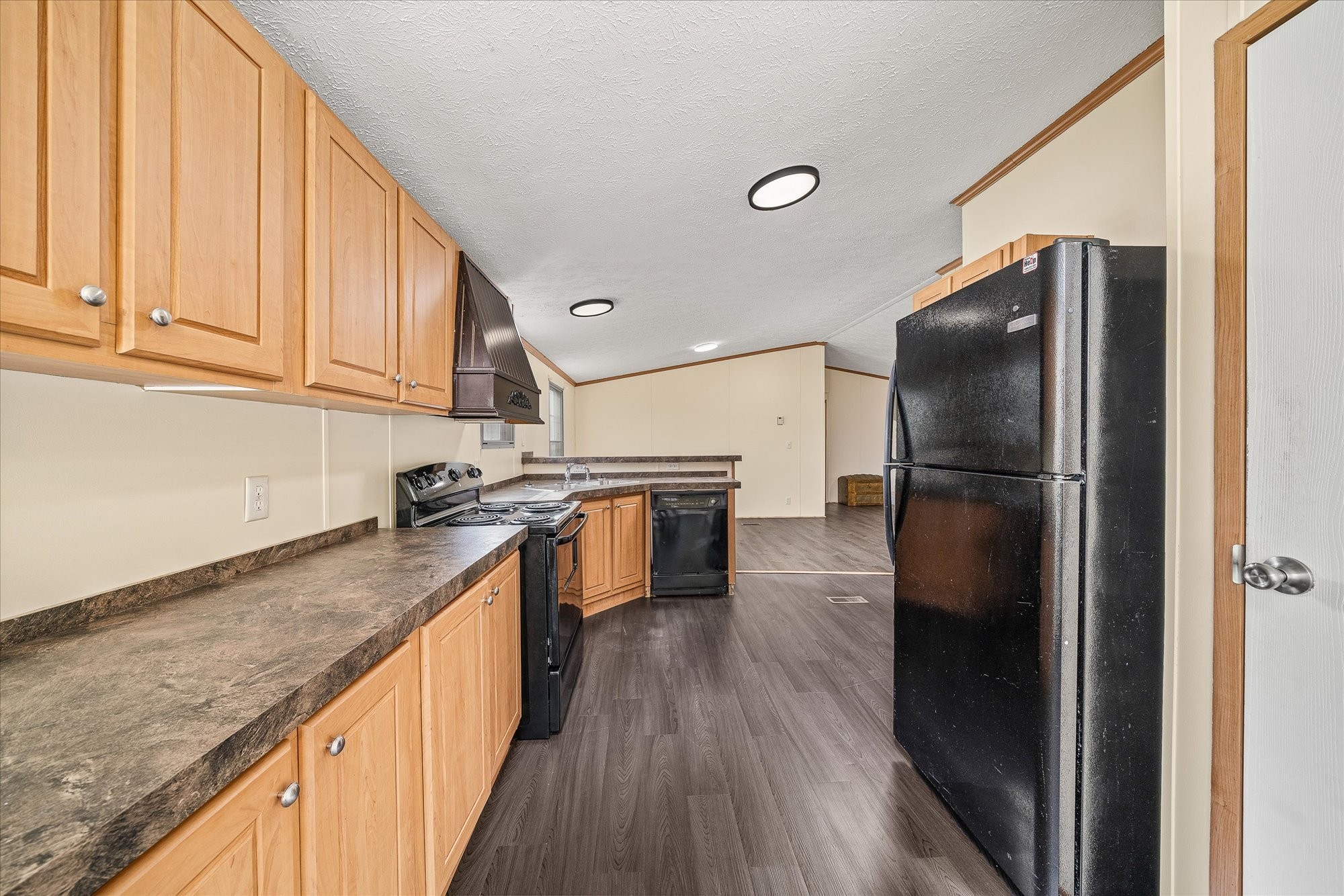 1476 Conrad Templeton Road Quebeck, TN 38579 - Photo 13 of 31 a kitchen with granite countertop stainless steel appliances a refrigerator and a sink