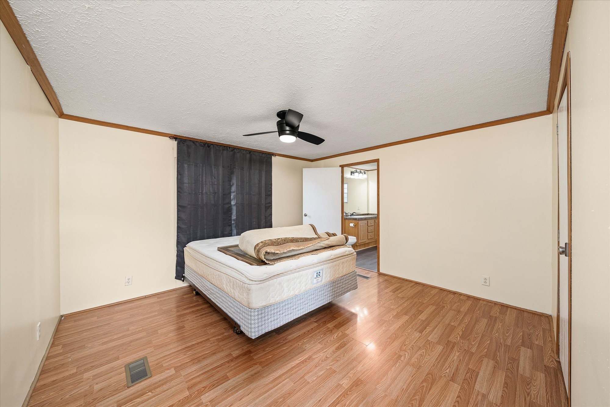 1476 Conrad Templeton Road Quebeck, TN 38579 - Photo 17 of 31 a view of a livingroom with wooden floor and a ceiling fan