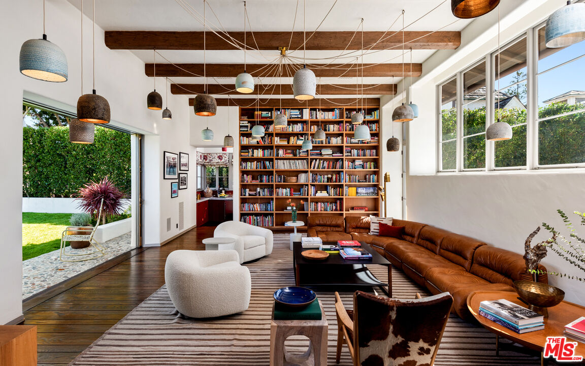 211 South Muirfield Road Los Angeles, CA 90004 - Photo 11 of 38 a view of a patio with couches table and chairs and potted plants