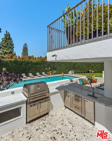 a view of a swimming pool with a lounge chairs