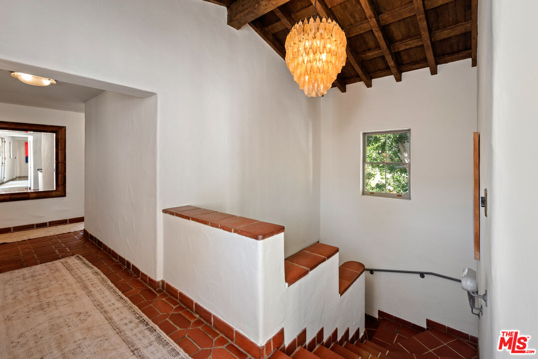 211 South Muirfield Road Los Angeles, CA 90004 - Photo 24 of 38 a view of a hallway with wooden floor and a bathroom