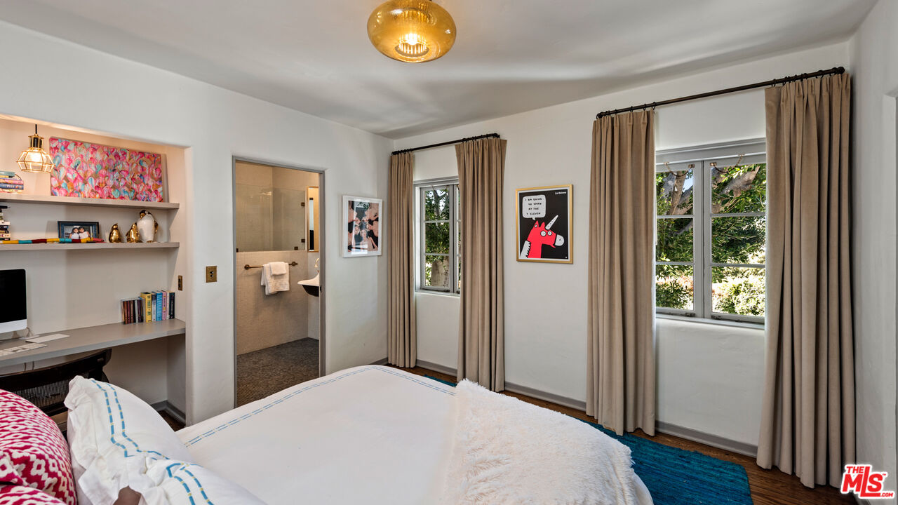 211 South Muirfield Road Los Angeles, CA 90004 - Photo 33 of 38 a bedroom with a bed and a window