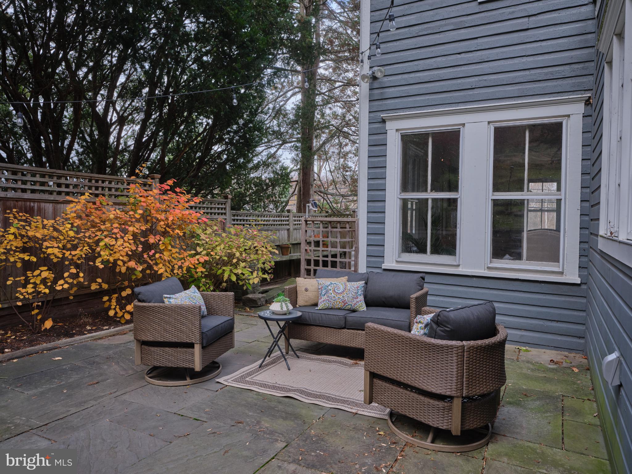 3697 River Road Lumberville, PA 18933 - Photo 21 of 26 Charming patio retreat with vibrant foliage.