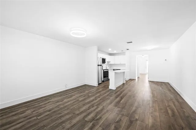 a view of kitchen with wooden floor
