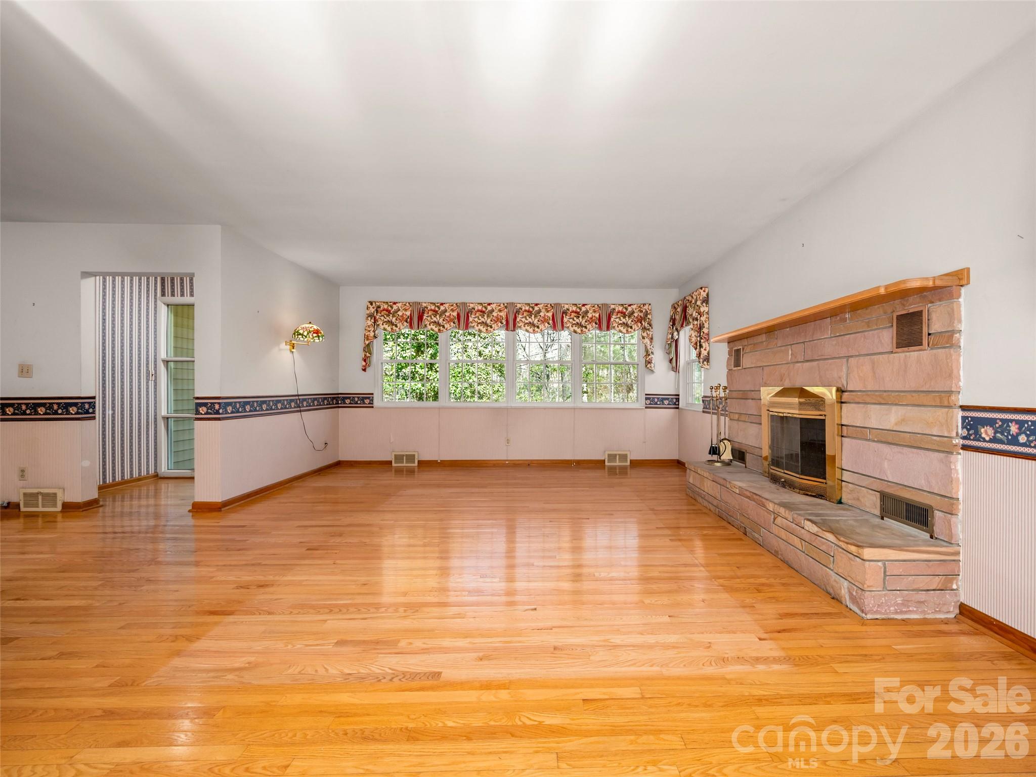 3 Country Road Hendersonville, NC 28791 - Photo 12 of 48 a view of an empty room with a window and fire place