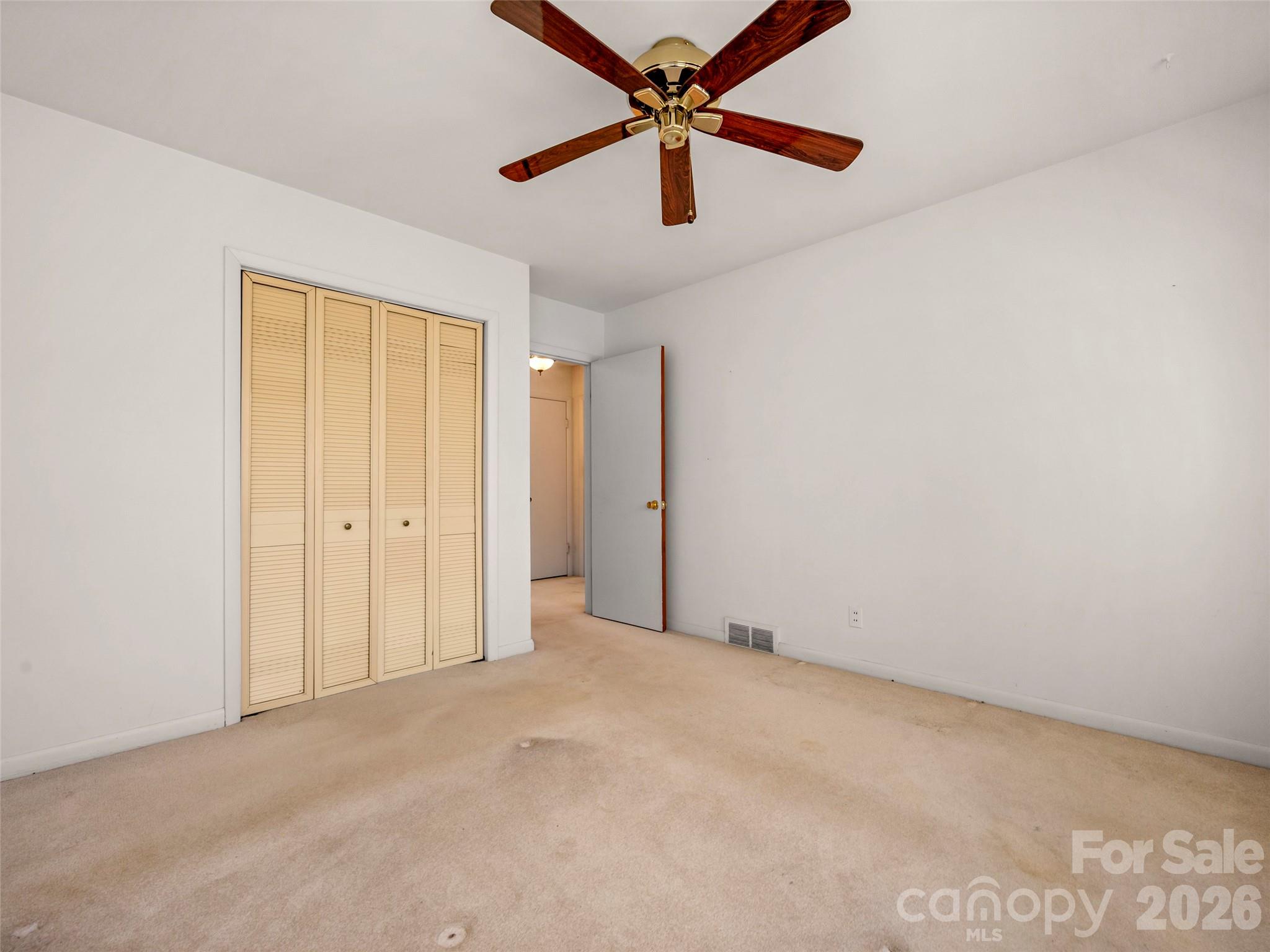3 Country Road Hendersonville, NC 28791 - Photo 20 of 48 an empty room with chandelier fan