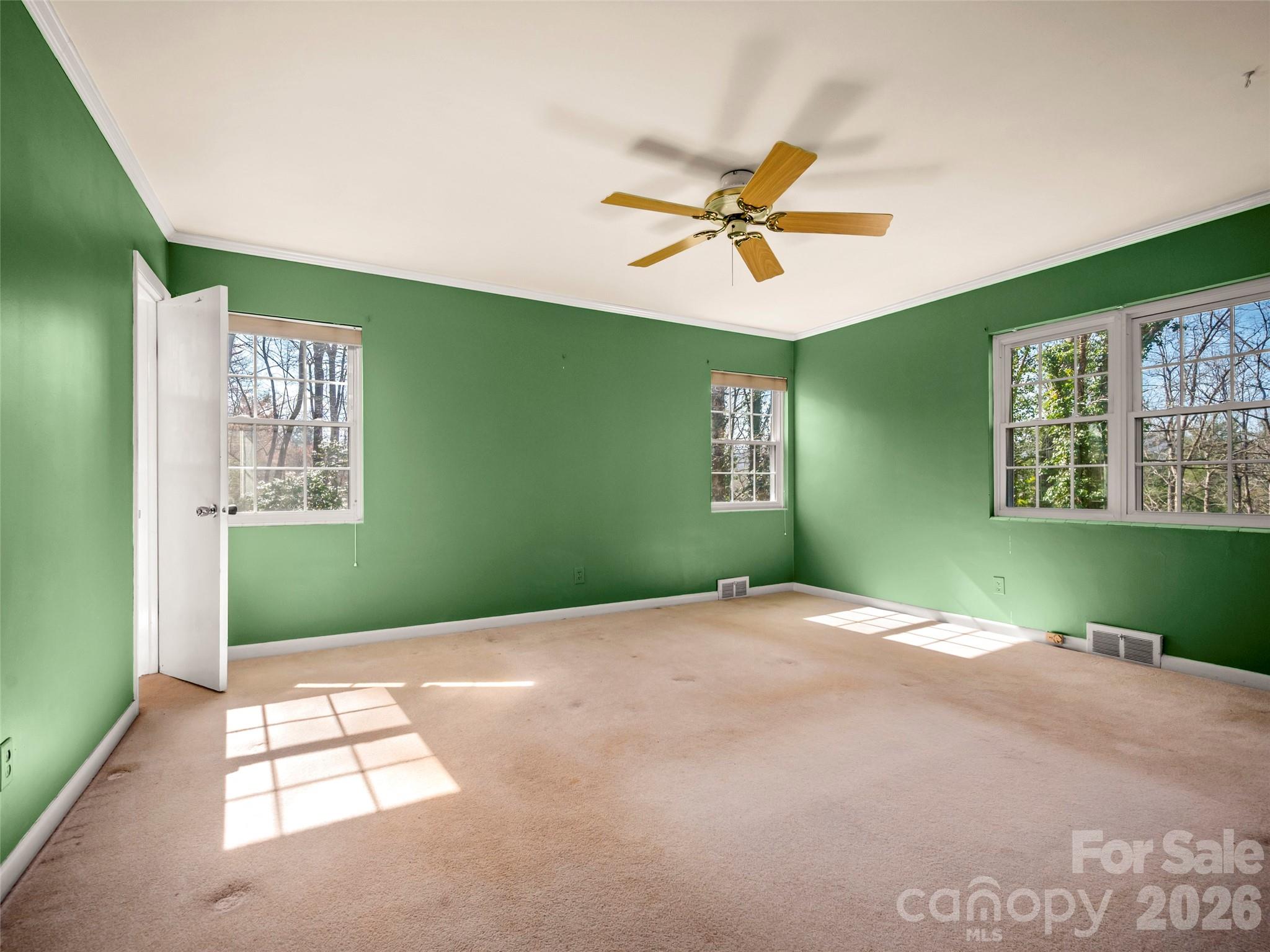 3 Country Road Hendersonville, NC 28791 - Photo 24 of 48 a view of a big room with windows and fan