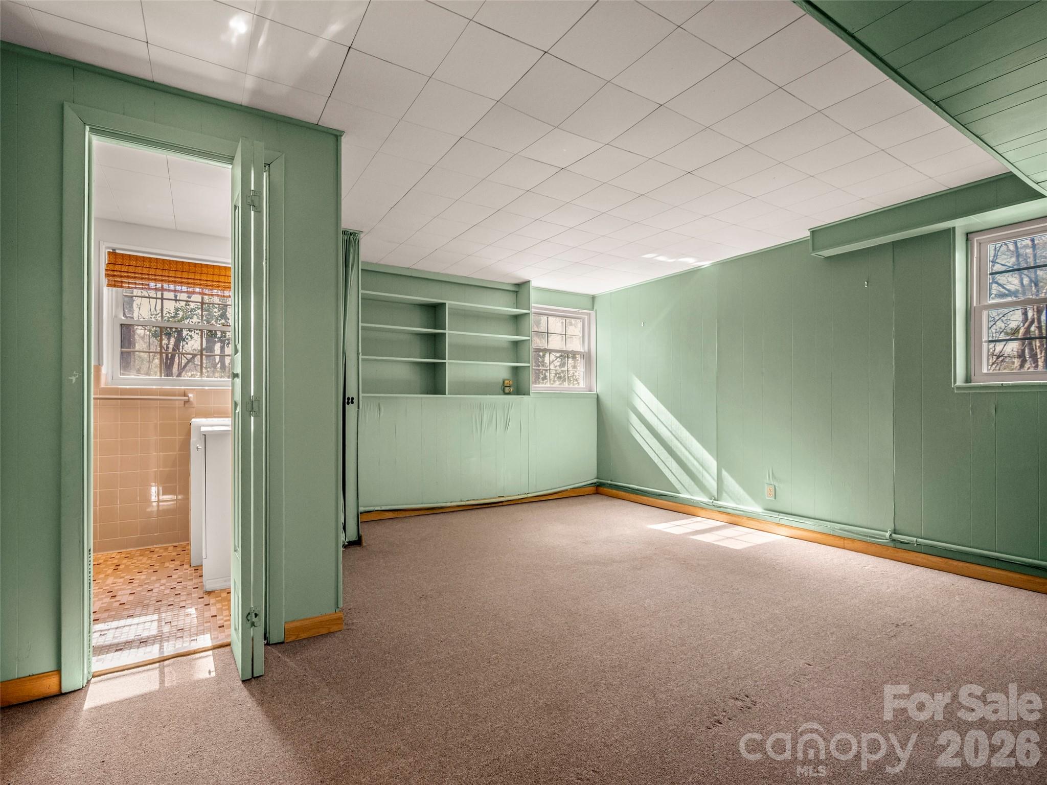 3 Country Road Hendersonville, NC 28791 - Photo 28 of 48 a view of an empty room with glass door