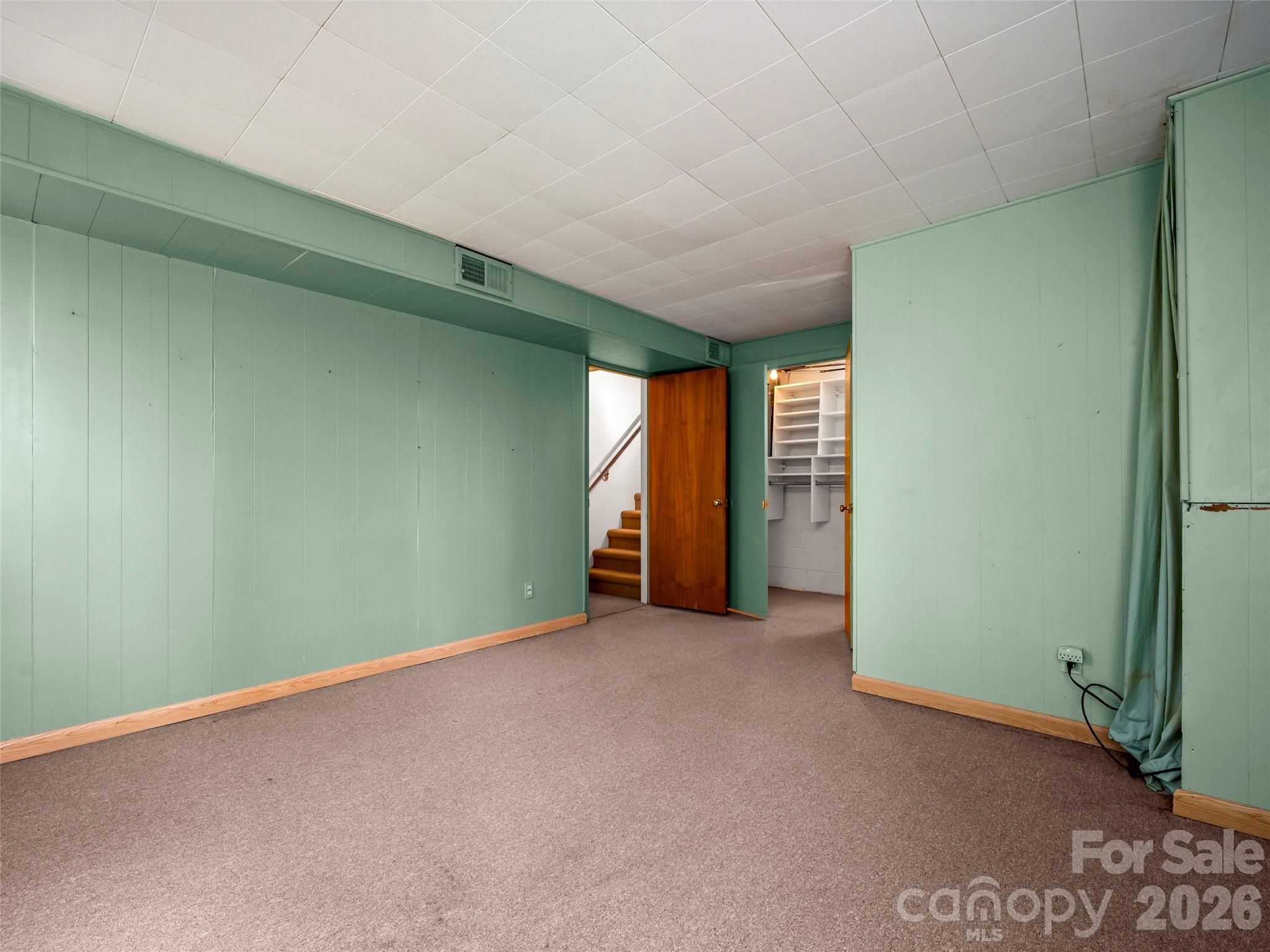 3 Country Road Hendersonville, NC 28791 - Photo 29 of 48 a view of an empty room with window and stairs