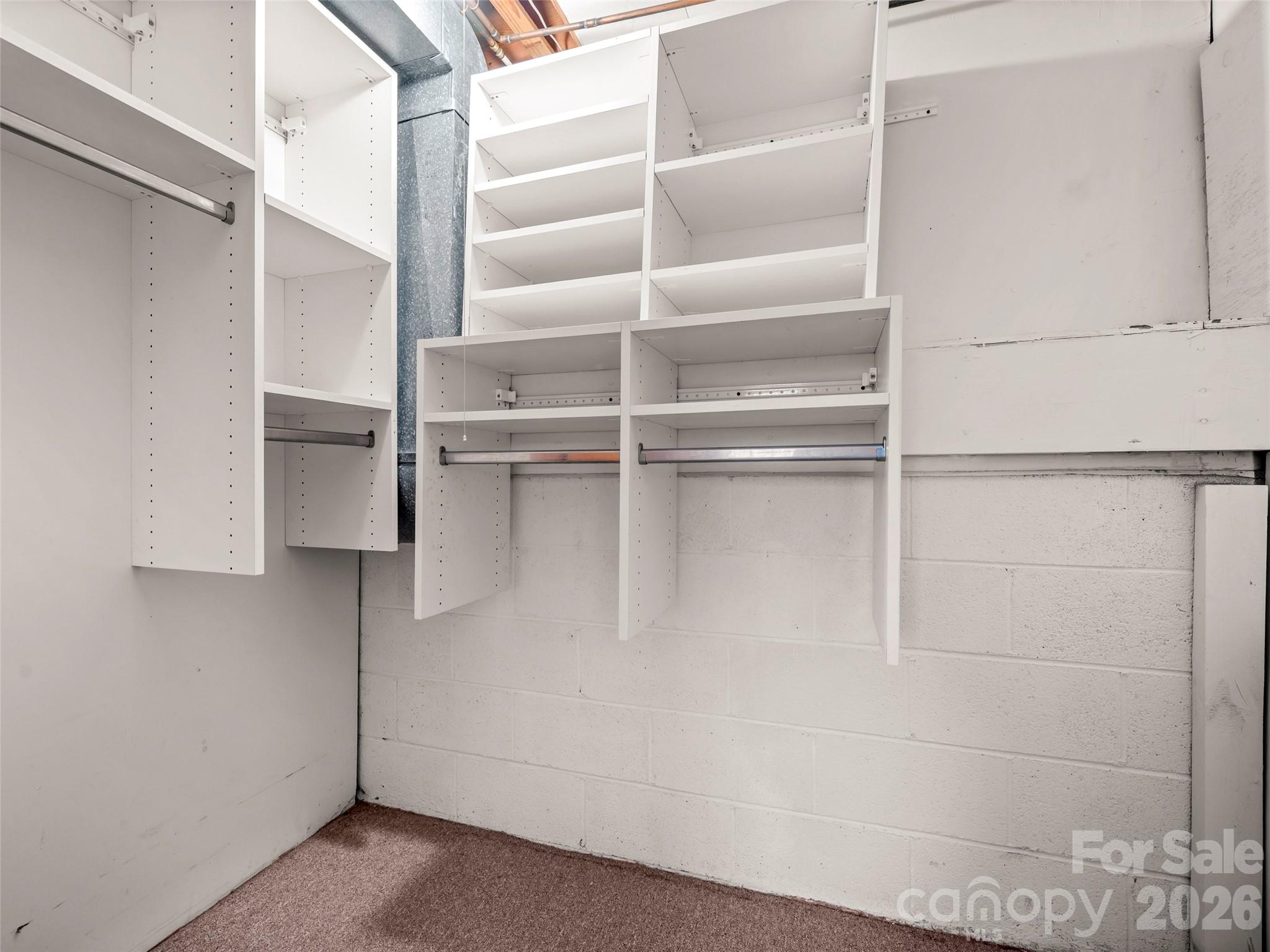 3 Country Road Hendersonville, NC 28791 - Photo 30 of 48 a view of walk in closet with empty racks