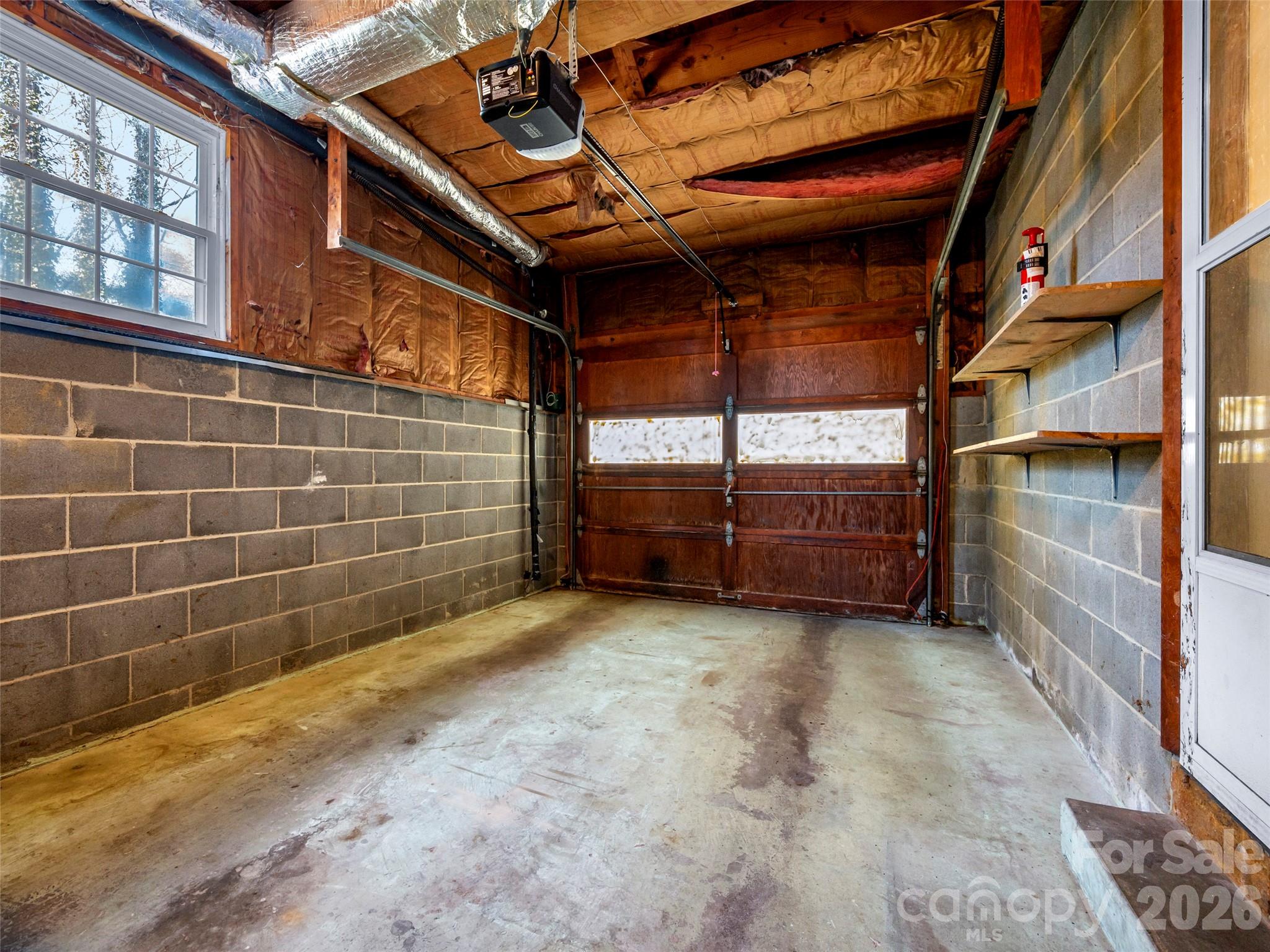 3 Country Road Hendersonville, NC 28791 - Photo 33 of 48 a view of a room with racks on the wall