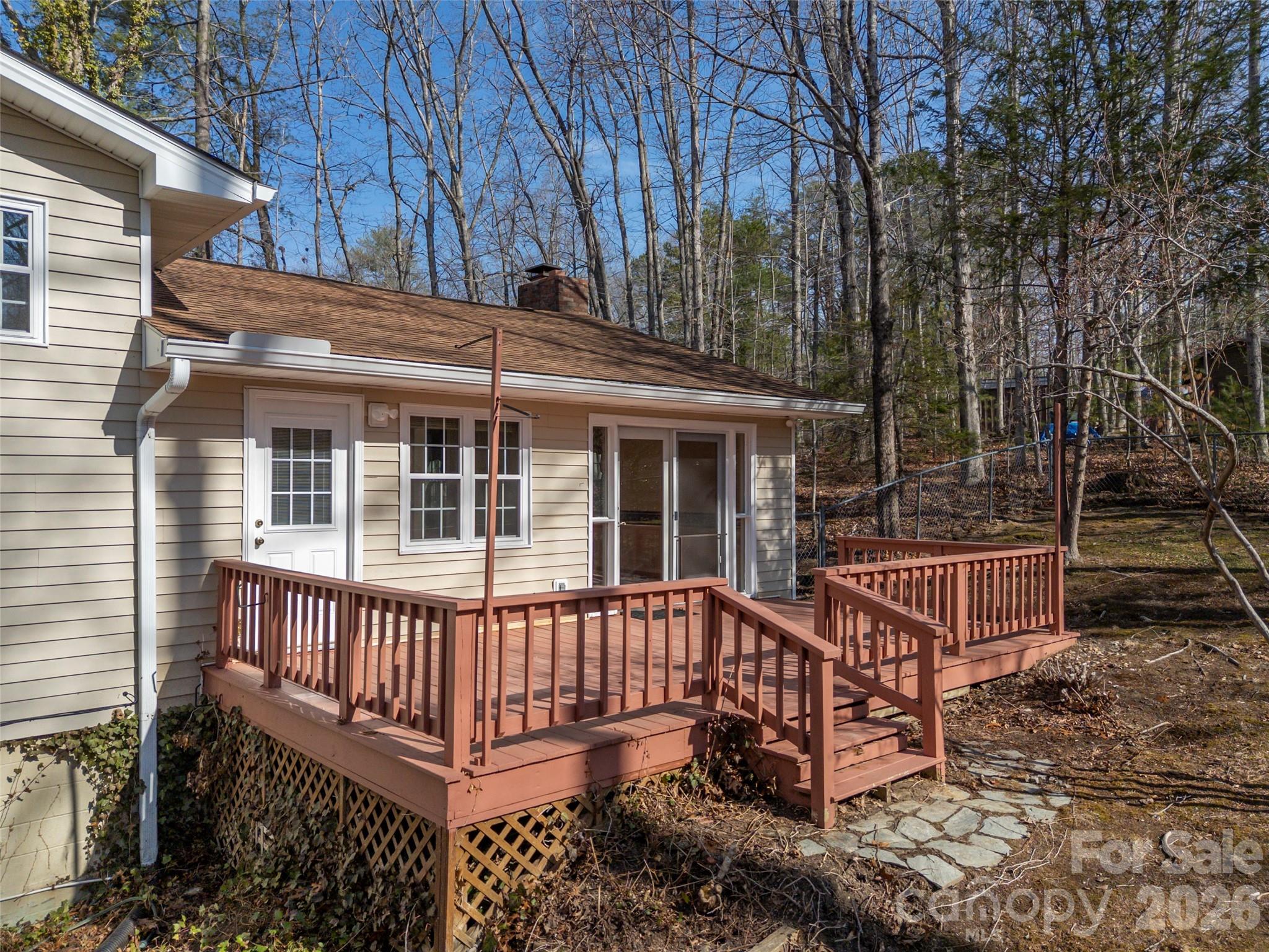 3 Country Road Hendersonville, NC 28791 - Photo 39 of 48 a view of a roof deck with wooden fence and floor