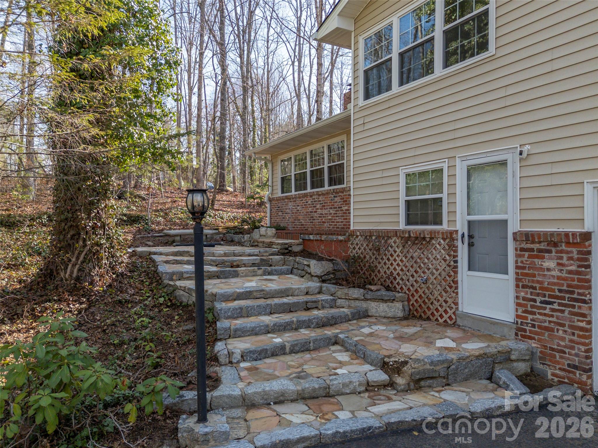 3 Country Road Hendersonville, NC 28791 - Photo 6 of 48 a view of a house with a yard
