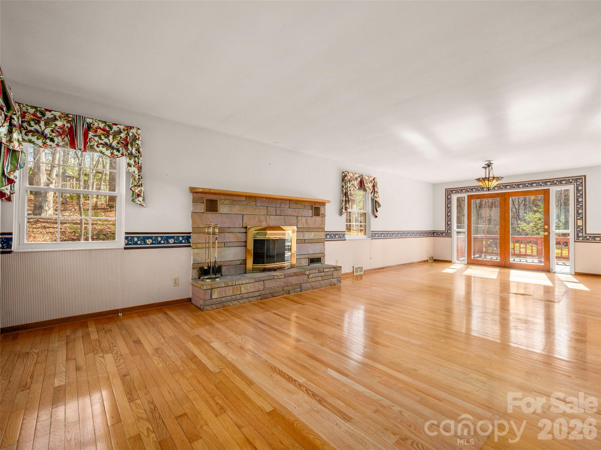 3 Country Road Hendersonville, NC 28791 - Photo 9 of 48 a living room with fireplace furniture and a wooden floor