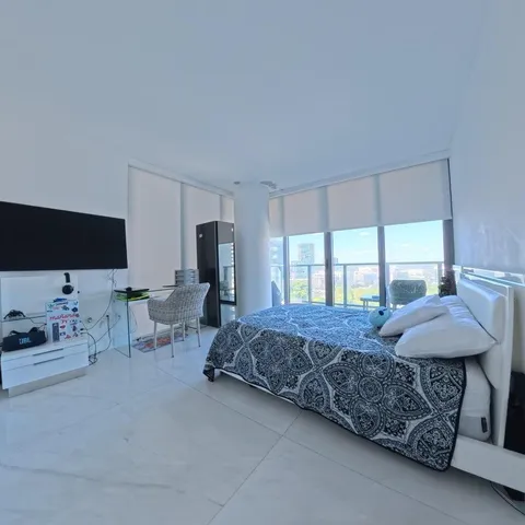 a view of a room with table and chairs